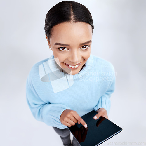 Image of Top view, tablet screen and portrait of studio woman on isolated white background and pressing for internet connection. Smile, face and POV of happy female person with tech app, web or website mockup