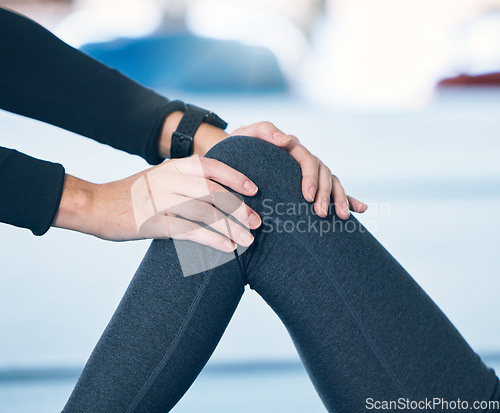 Image of Physiotherapy, hands and therapist working on knee for muscle movement or motion at clinic. Rehabilitation, recovery and athlete patient with leg injury, pain or accident with doctor for medical help