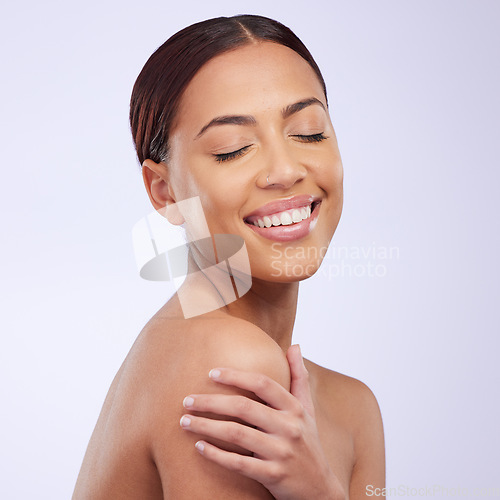 Image of Woman, beauty and skincare in a studio with happiness and smile from dermatology. Skin glow, natural facial and cosmetics of a young female model feeling happy from self care and face wellness