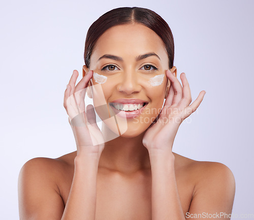 Image of Beauty, skincare or happy woman with sunscreen product in daily grooming treatment with makeup cosmetics. Dermatology, white background or girl model smiling or applying facial cream lotion in studio