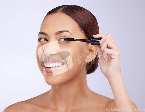 Image of Face, mascara makeup or happy woman in studio isolated on white background in facial treatment. Skincare beauty, grooming brush or girl model smiling with tools or luxury self care eyelash cosmetics