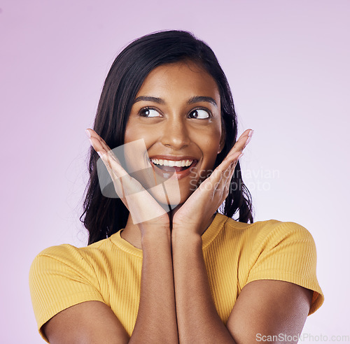 Image of Excited, beauty and face of happy Indian woman on pink background with smile, confidence and surprise. Happiness, fashion and girl pose with hands in studio with cosmetics, natural makeup and style