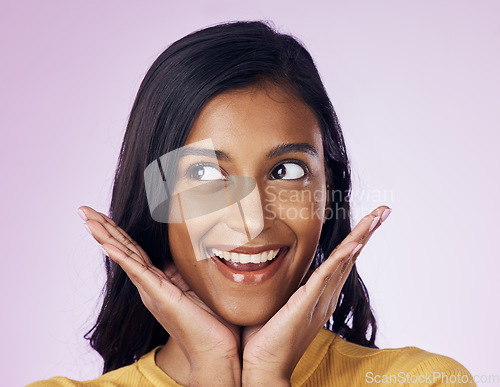 Image of Excited, beauty and face of happy Indian woman on pink background with smile, cosmetics and surprise. Happiness, fashion and girl pose with hands in studio for promotion, announcement and good news