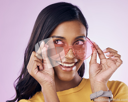 Image of Glasses, sunglasses and cool woman excited, happy and confident isolated in a pink studio background with joy. Vision, thinking and young gen z female with stylish frames with a positive energy