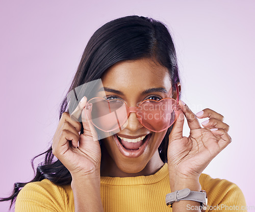 Image of Portrait, sunglasses and cool woman excited, happy and confident isolated in a pink studio background with joy. Fashion, vision and young gen z female with new frames, eyewear or glasses