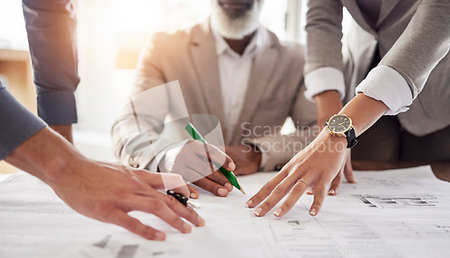 Image of Business people, hands and meeting with blueprint in planning, strategy or brainstorming for construction at office. Hand of architect or group working in teamwork on floor plan, drawing or sketch