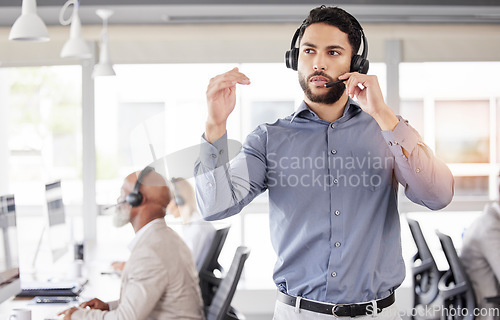 Image of Businessman, call center or consulting headphones for customer service, telemarketing or support office. Man, consultant or headset talking for problem solving, help or team management in contact us