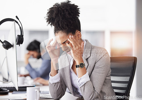 Image of Business woman, headache and stress in burnout, fatigue or overworked at the office. Stressed, tired and exhausted female suffering bad head pain, sore or ache from strain in discomfort at workplace
