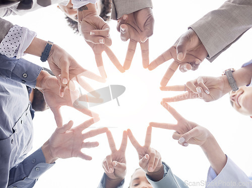 Image of Business people, hands together and peace sign in teamwork or unity forming a star for collaboration below. Hand of team, group or community in trust, coordination and solidarity with sign or signal