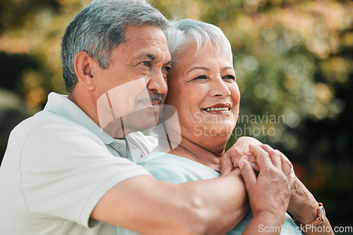 Image of Love, retirement and an old couple hugging outdoor while thinking about memories in the garden together. Nature, peace or marriage with a senior man and woman bonding in a park in the countryside