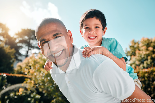 Image of Portrait, piggyback and a boy flying on the shoulders of his father outdoor in the garden while bonding together. Family, children or love and a son playing with his dad in the backyard of their home