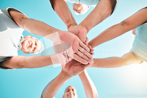 Image of Group, hands stacked and teamwork by people in unity, support and collaboration together for a goal. Motivation, trust and team planning a goal, mission or vision in a community in solidarity