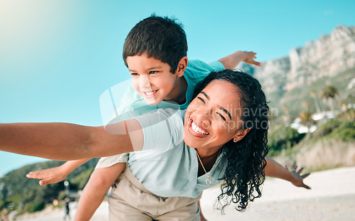 Image of Child, mother or happy family outdoor at beach playing airplane game for fun. Young woman and boy kid play for happiness, freedom and adventure on a travel holiday or vacation with love outdoor