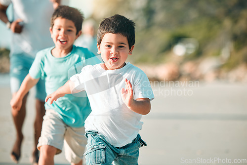 Image of Running, playful and portrait of children at the beach for a holiday, weekend fun and bonding. Happy, freedom and boy kids at the sea in nature to run, play and be free with family on vacation