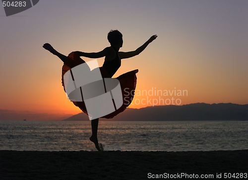 Image of Dancing woman on the beach