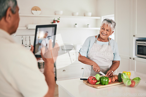 Image of Kitchen cooking, elderly couple or tablet photo of senior woman, wife or person with online memory picture. Nutritionist food, love or laughing people bonding, happy and prepare vegetable ingredients