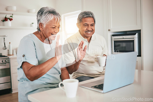 Image of Laptop, video call and hello by elderly couple in a kitchen and happy or relaxed in home. Love, online and old people wave, smile and excited for tech conversation while enjoying retirement together