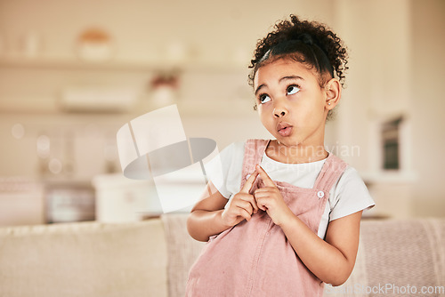 Image of Thinking face, child and ideas in home on a living room couch and wondering with mockup. Young, lounge sofa and cute, curious girl in a relaxed house or indoor with youth idea and planning expression