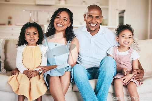 Image of Family in portrait, parents and happy children relaxing at home in support, love or bonding together on sofa. Happiness, people or living room with relationship or spending quality time on a weekend