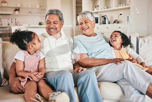 Image of Family, grandparents and kids laughing at home with love, care and bonding together on relax sofa. Happiness, children and people laugh at funny joke, relationship or spending quality time on weekend