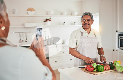 Image of Kitchen cooking, elderly couple or phone photo of senior man, husband or nutritionist person with memory picture. Vegan food, love or people bonding, happy or prepare vegetables ingredients for lunch