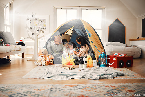 Image of Love, home camping and happy family bonding, relax and enjoy time together having fun in living room. Happiness, tent and youth children playing with mother, father or parents in house adventure