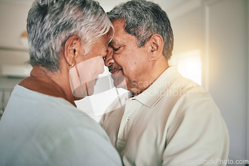 Image of Forehead touch, love and senior couple in care, romantic spouse support or relax in retirement time together. Romance connection, marriage partner and elderly woman, old man or people bonding at home