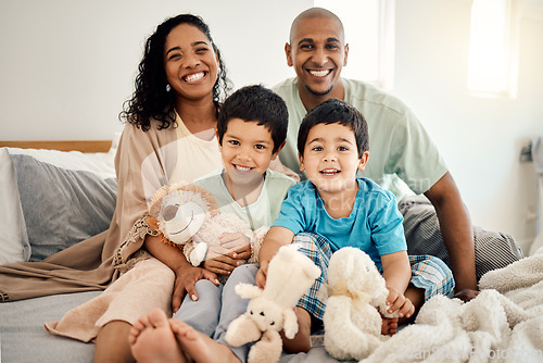 Image of Happy family, bed and portrait of parents and children bonding in a bedroom in a house and playing together. Care, mother and father excited with kids in the morning as love, happiness and care