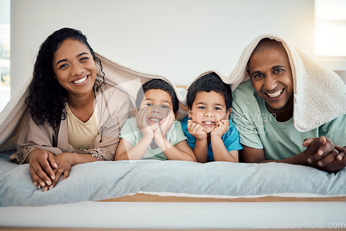 Image of Happy family, morning bed portrait and relax mother, father and children smiling, home bonding and enjoy time quality together. Comfort, love smile and cozy man, woman and youth kids lying in bedroom