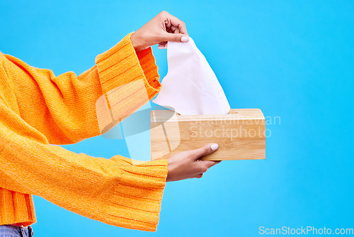 Image of Box, blue background and hands of woman with tissues for flu, sickness and sinus mockup in studio. Healthcare, toiletries and girl with handkerchief, napkin and paper for cleaning, allergy and sneeze