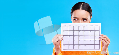 Image of Calendar, thinking and woman on blue background with poster for schedule, planning and agenda in studio. Time management, strategy and girl with month template for date, weekly planner and event