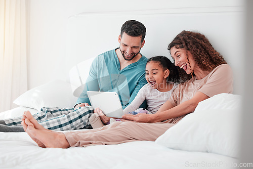 Image of Mom, dad and child on bed with tablet, watching movies, streaming service for child development. Interracial family in bedroom bonding with happy online movie, man and woman with girl and happiness.