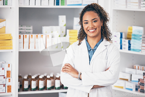 Image of Pharmacy, pharmacist or portrait of woman with arms crossed or smile in customer services or clinic. Healthcare help desk, wellness or happy doctor smiling by medication on shelf in drugstore