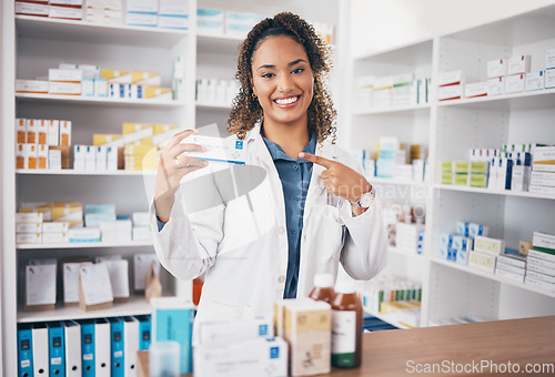 Image of Pointing, pharmacist or portrait of happy woman with medicine in customer services or wellness clinic. Healthcare help desk, pharmacy or doctor smiling to promote medication or pills on drugstore