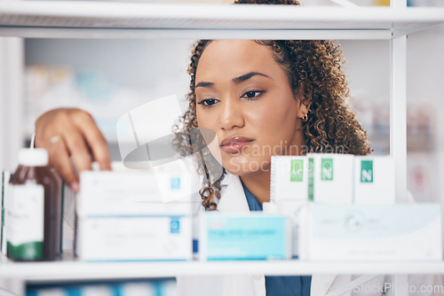 Image of Reading, woman or pharmacist with medicine pills or supplements products to check drugs inventory. Wellness, healthcare or doctor with boxes of medical product or stock on shelf in retail pharmacy