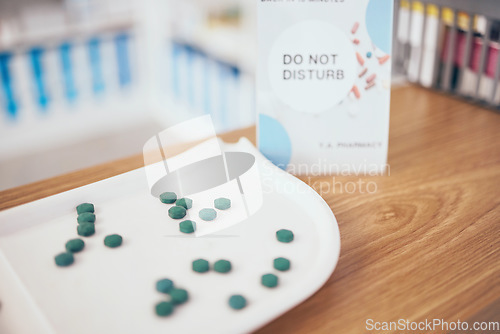 Image of Pills, healthcare and medicine in an empty pharmacy for the treatment or cure of disease and insurance. Do not disturb, medical and medicine dose, supply or course in a pharmaceuticals clinic