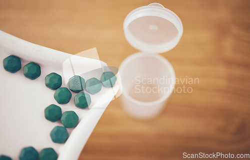 Image of Medicine, container or organize pills for pharmacy correct dose, inventory or pharmaceutical management. Closeup of healthcare tablets, medical products background or retail store stock distribution