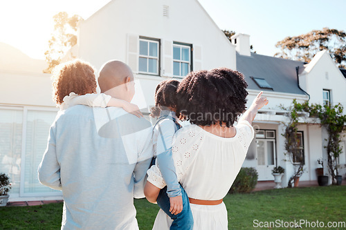 Image of Real estate, love and family in the yard of their new house bonding and spending quality time together. Mortgage, luxury property and back of young mom, dad and children standing by their modern home