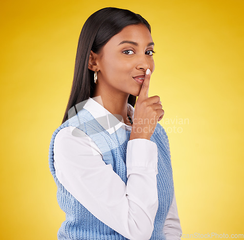 Image of Secret, woman portrait and studio with gossip, news and emoji with privacy. Isolated, yellow background and young female with a whisper, confidential drama and opinion with a happy face and hush