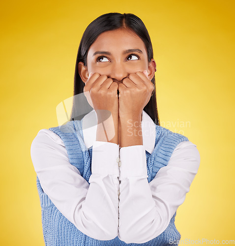 Image of Silly, woman and happy in a studio with a female model feeling playful and cute. Isolated, yellow background and young person with funny, comic and goofy happiness with emoji and fun joke alone