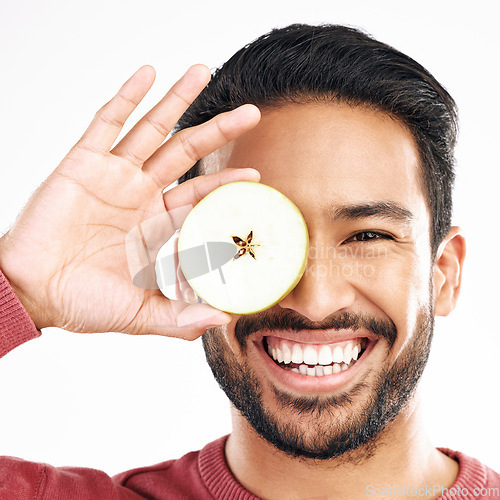 Image of Apple, fruit and portrait of man with smile on white background for diet, nutrition and detox. Healthy body, food and isolated face of happy male with slice for breakfast, snack and lunch in studio