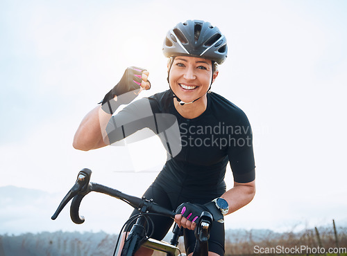 Image of Fitness, celebration and portrait of woman cycling with power fist, success or victory in the countryside. Happy, sports and face of lady cyclist celebrating workout achievement, milestone or winning