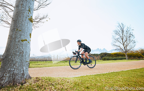 Image of Cycling, fitness and sports with woman in park for training, workout and health mockup. Exercise, travel and freedom with female cyclist riding on bike in nature for adventure, journey and transport