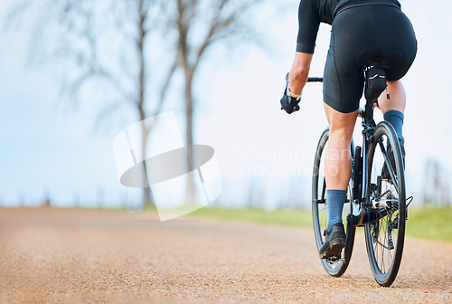 Image of Bicycle, outdoor and person on a bike ride with mockup for sports race on a gravel road. Fitness, exercise and fast athlete doing sport training in nature on a park trail for cardio and workout