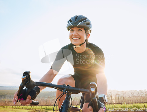 Image of Cycling, fitness and happy with woman in park for training, workout and cardio health. Exercise, travel and freedom with female cyclist riding on bike in nature for adventure, journey and transport