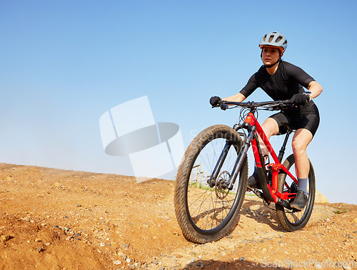 Image of Bicycle, ride outdoor and woman on a bike with cycling for sports race on a gravel road. Fitness, exercise and athlete doing sport training in nature on trail for cardio and workout with mockup