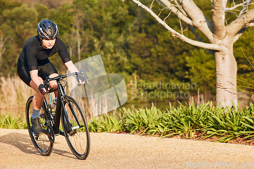 Image of Summer, fitness and cycling with woman on dirt path in nature for workout, training and sports competition. Strong, cardio and exercise with female cyclist riding on bike for adventure and journey