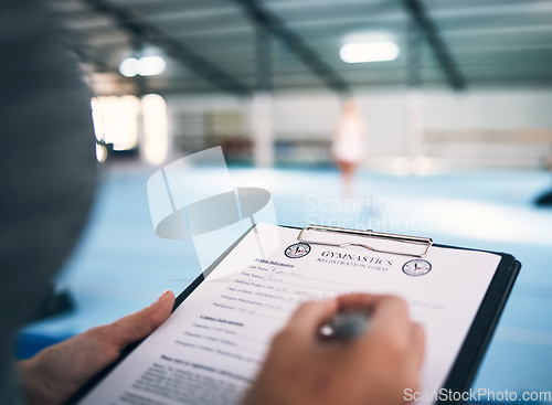 Image of Hand, documents and sign up in a gym with a coach watching a performance for membership or contract. Paper, checklist and personal trainer in a sports center for fitness, planning or assessment