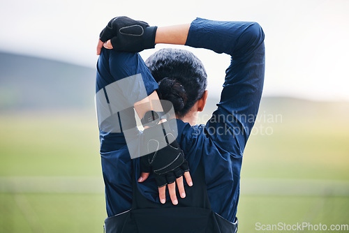 Image of Fitness, workout and woman stretching her arms for outdoor training for a race, marathon or competition. Sports, health and back of a female athlete runner doing a warm up exercise before running.