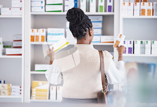 Image of Woman, drugs and shelf for healthcare illness, pain or relief at pharmacy looking at pills or medication. Sick female customer or patient taking pharmaceutical products for self diagnosis at a clinic